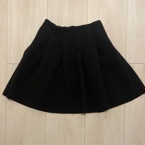 Pleated wool mini skirt